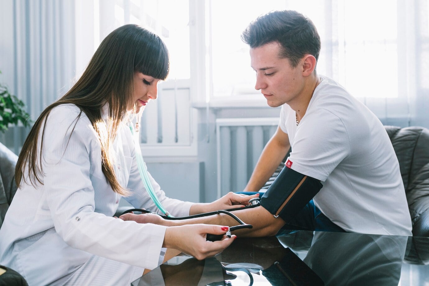 A nurse checking a patient's blood pressure during medically supervised detox