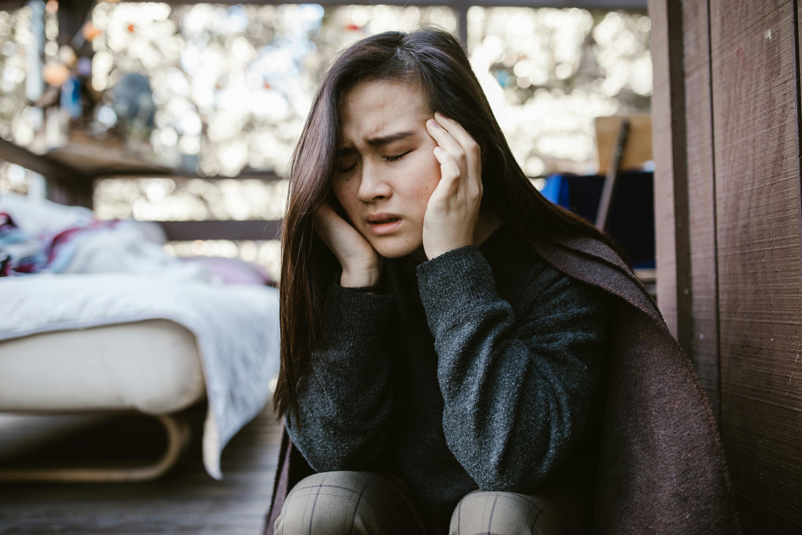 Person practising gentle trauma-sensitive yoga in a calm setting